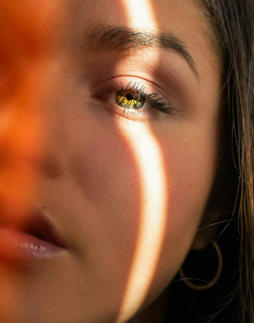 Warm light falling across clear, glowing skin